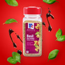 Basil Balsamic seasoning bottle on a red background with basil leaves and balsamic glaze.
