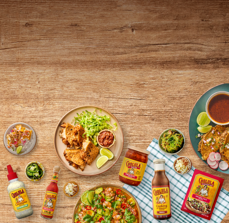 Assorted food items and Cojuela products on a wooden table