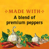 An illustration of garlic peppers and herbs with the text Made with a blend of premium peppers.