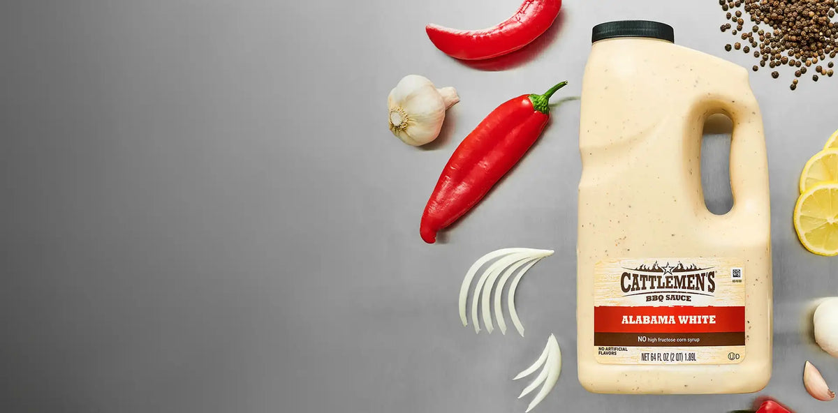 Cattlemen's Alabama White sauce bottle with ingredients on a gray background