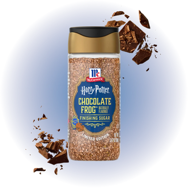 A bottle of McCormick Harry Potter Chocolate Frog Finishing Sugar, with chocolate shavings.
