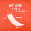 A white illustration of a habanero pepper on a red background with the words Heatmeter Sweet Habanero and a scale of hot to mild.
