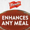 A bowl of French\'s ketchup with the text Enhances Any Meal on top.