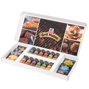 An open white gift box displays a variety of McCormick Grill Mates seasonings and marinades, including Montreal Steak, Brown Sugar Bourbon, and Hawaiian Style BBQ.