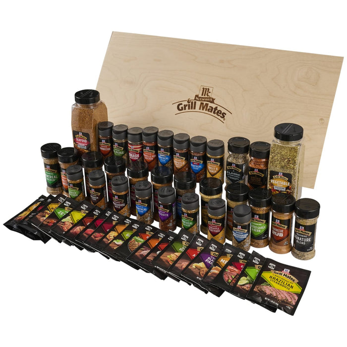 A comprehensive collection of McCormick seasonings and marinades featuring the Dtc Grill Mates Dtcmccgmvp Bundle displayed with a wooden branded crate lid.