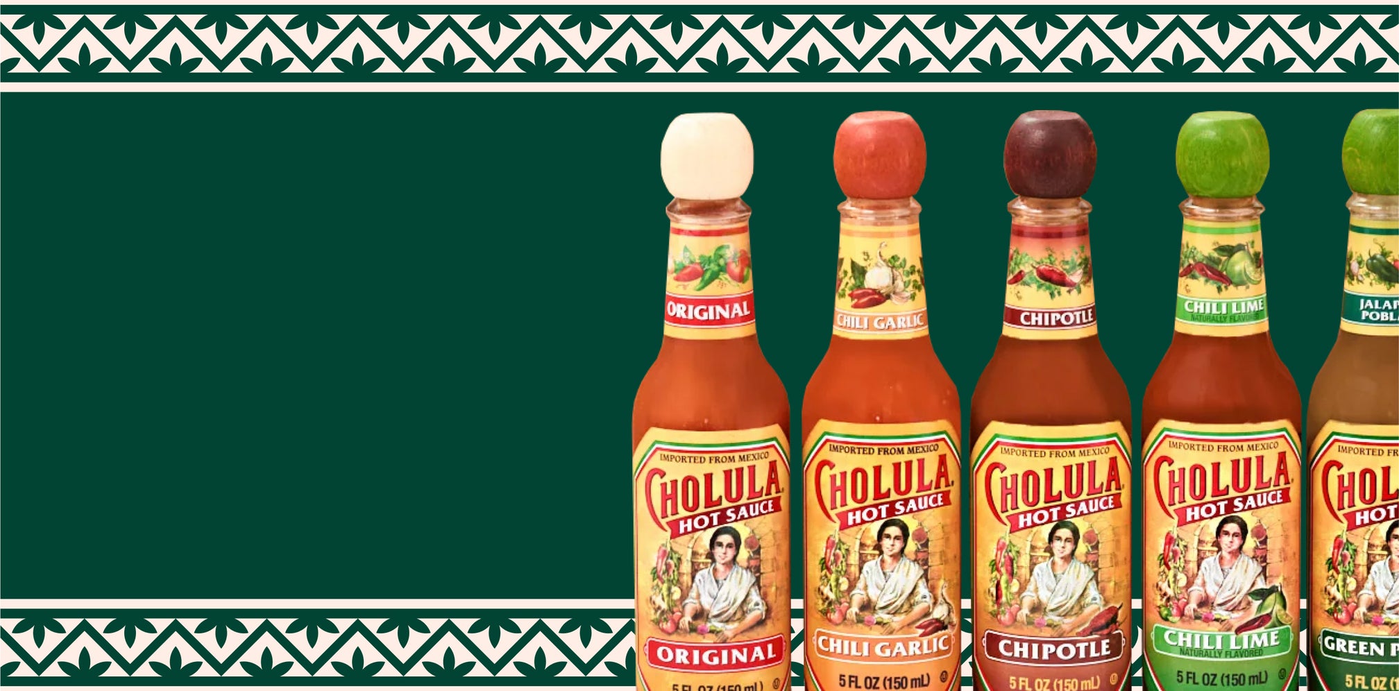 Row of Cholula hot sauce bottles on a green background