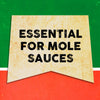 A vintage-style banner with the text Essential for Mole Sauces in black on a yellow background.