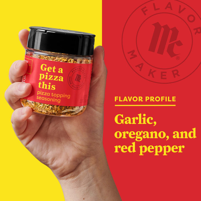 A hand holds a jar of Flavor Maker pizza topping seasoning with a red background that says Flavor Profile: Garlic, oregano, and red pepper.