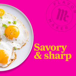 A plate of fried eggs with a Flavor Maker logo and the text Savory &amp; sharp on a pink background.