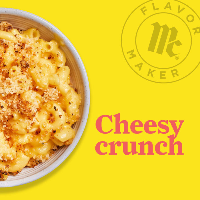 A bowl of cheesy mac and cheese with a crispy breadcrumb topping, next to the Flavor Maker logo and the text Cheesy crunch.