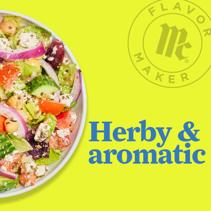 A bowl of salad with feta cheese, tomatoes, cucumbers, red onion, and chickpeas with the Flavor Maker logo and the text Herby &amp; aromatic in blue.