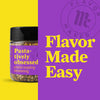 A jar of Flavor Maker pasta seasoning with the words Pasta-tively obsessed and pasta topping seasoning on the label.