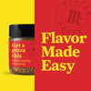 A jar of Flavor Maker pizza topping seasoning with the text Get a pizza this on a red background with the Flavor Maker logo.