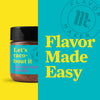A jar of Flavor Maker taco night topping seasoning with the brand logo and the text Flavor Made Easy in the background.