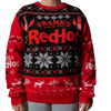 A person wears a festive holiday sweater featuring the Frank s RedHot logo along with illustrations of hot sauce bottles and chili peppers.