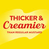 A yellow background with red text that reads Thicker &amp; Creamier than regular mustard.