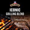 A juicy steak is being grilled with McCormick Grill Mates seasoning.