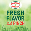 An advertisement for Gourmet Garden Basil (Case Of 72) featuring the Gourmet Garden logo and the slogan FRESH FLAVOR IN A PINCH against a blurred green background with grass at the bottom.