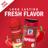 Two McCormick Paprika spice jars with red peppers.
