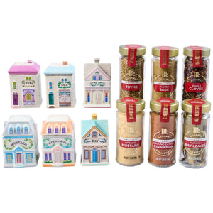 The Lenox Pack features six McCormick Gourmet organic spices, including Thyme, Sage, and Cinnamon, each paired with a corresponding decorative, house-shaped ceramic spice jar.
