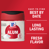 A container of McCormick Alum with a red lid and a white label.