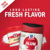 Two containers of McCormick Alum, one small and one large, with a red background and white powder spilling out.