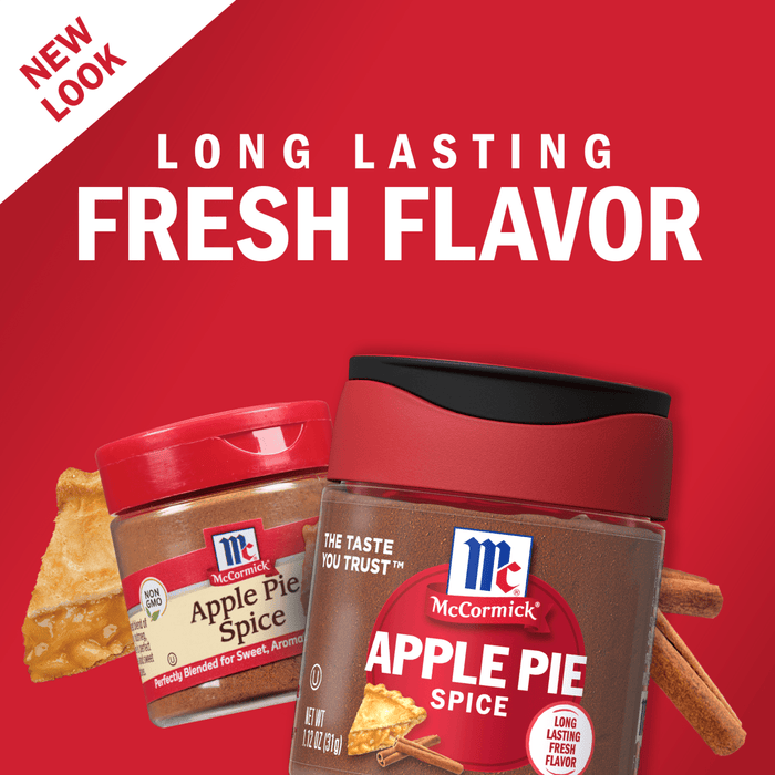 Two McCormick Apple Pie Spice jars with a slice of apple pie and cinnamon sticks on a red background.