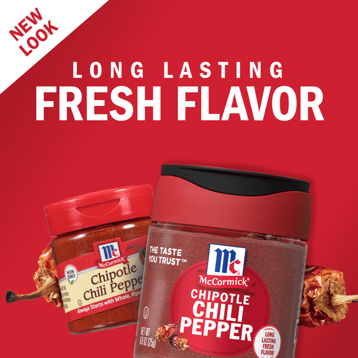 Two McCormick Chipotle Chili Pepper spice jars with dried chili peppers in the background.