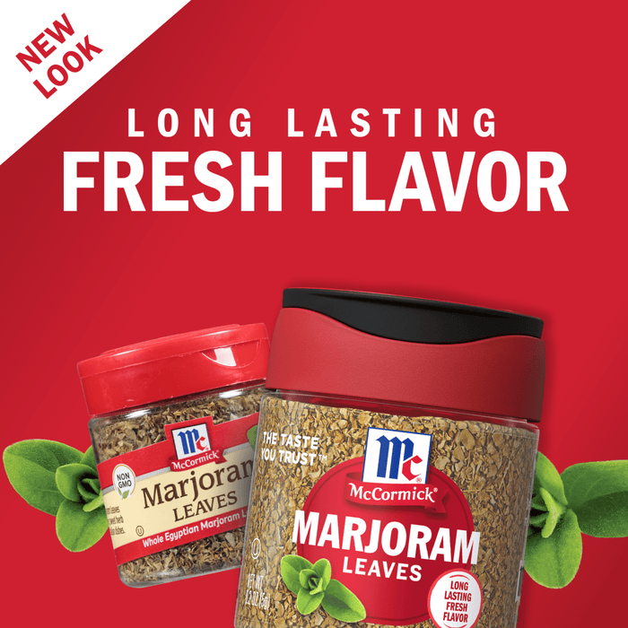 Two jars of McCormick Marjoram Leaves, one with a red lid and the other with a black lid, are shown on a red background with a green marjoram leaf.