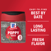 A container of McCormick Poppy Seed with a red poppy flower on the label.