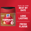 A jar of McCormick Pumpkin Pie Spice with a red lid and a pumpkin pie illustration on the label.