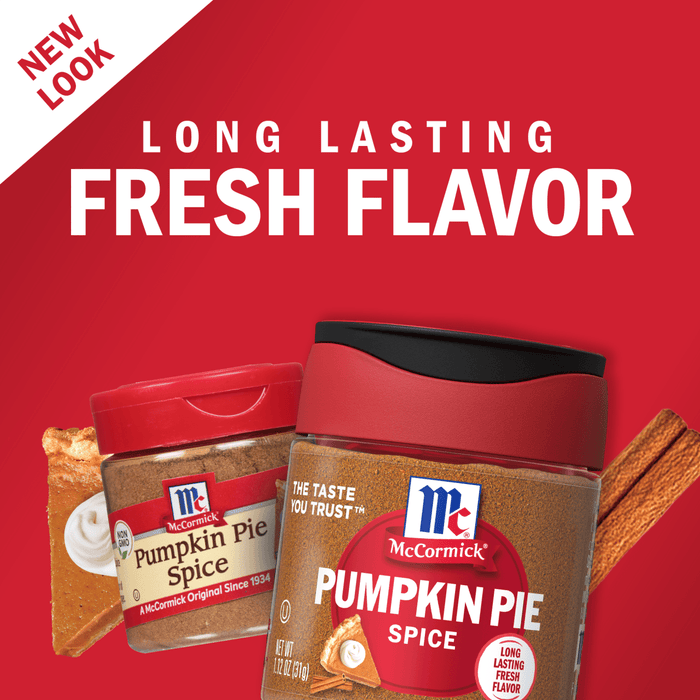 Two McCormick Pumpkin Pie Spice jars with a slice of pumpkin pie and cinnamon sticks.