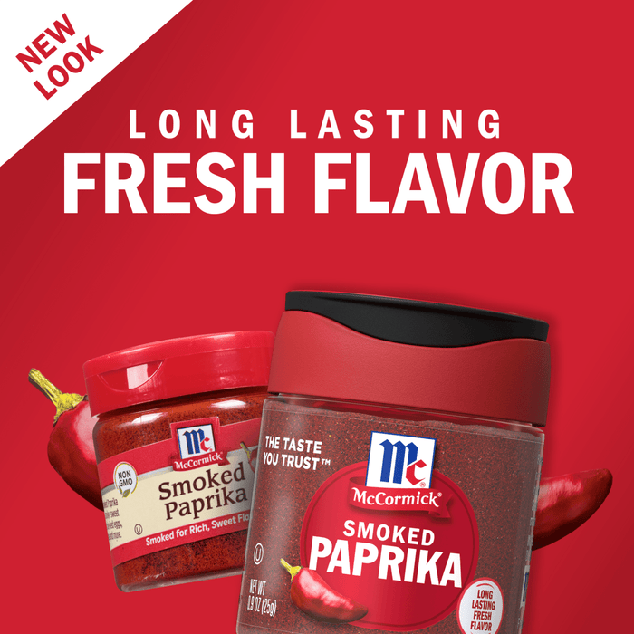 Two jars of McCormick Smoked Paprika, one with a red lid and one with a black lid, are shown with red chili peppers on a red background.