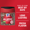 A jar of McCormick Allspice Whole, with a red lid and a clear jar filled with whole allspice berries.