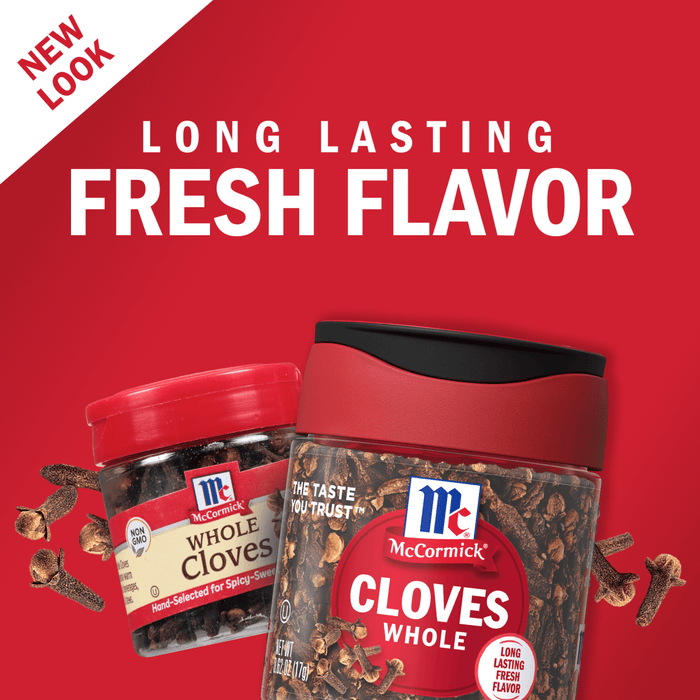 Two jars of McCormick Whole Cloves, one small and one large, with cloves scattered around them.