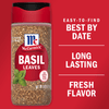 A container of McCormick Basil Leaves with a red background and text that says Easy-to-find Best By Date, Long Lasting Fresh Flavor.