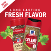 Two bottles of McCormick Celery Flakes, one with a red lid and one with a black lid, are shown with celery stalks.