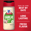 A container of McCormick Garlic Salt with a red lid and a white label.