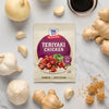 A packet of McCormick Teriyaki Chicken seasoning mix is surrounded by fresh ingredients like ginger, garlic, and soy sauce, suggesting a homemade meal.