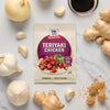 A packet of McCormick Teriyaki Chicken seasoning mix is surrounded by fresh ingredients like ginger, garlic, and soy sauce, suggesting a homemade meal.