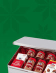 McCormick gift tin with assorted spices and extracts against green background.