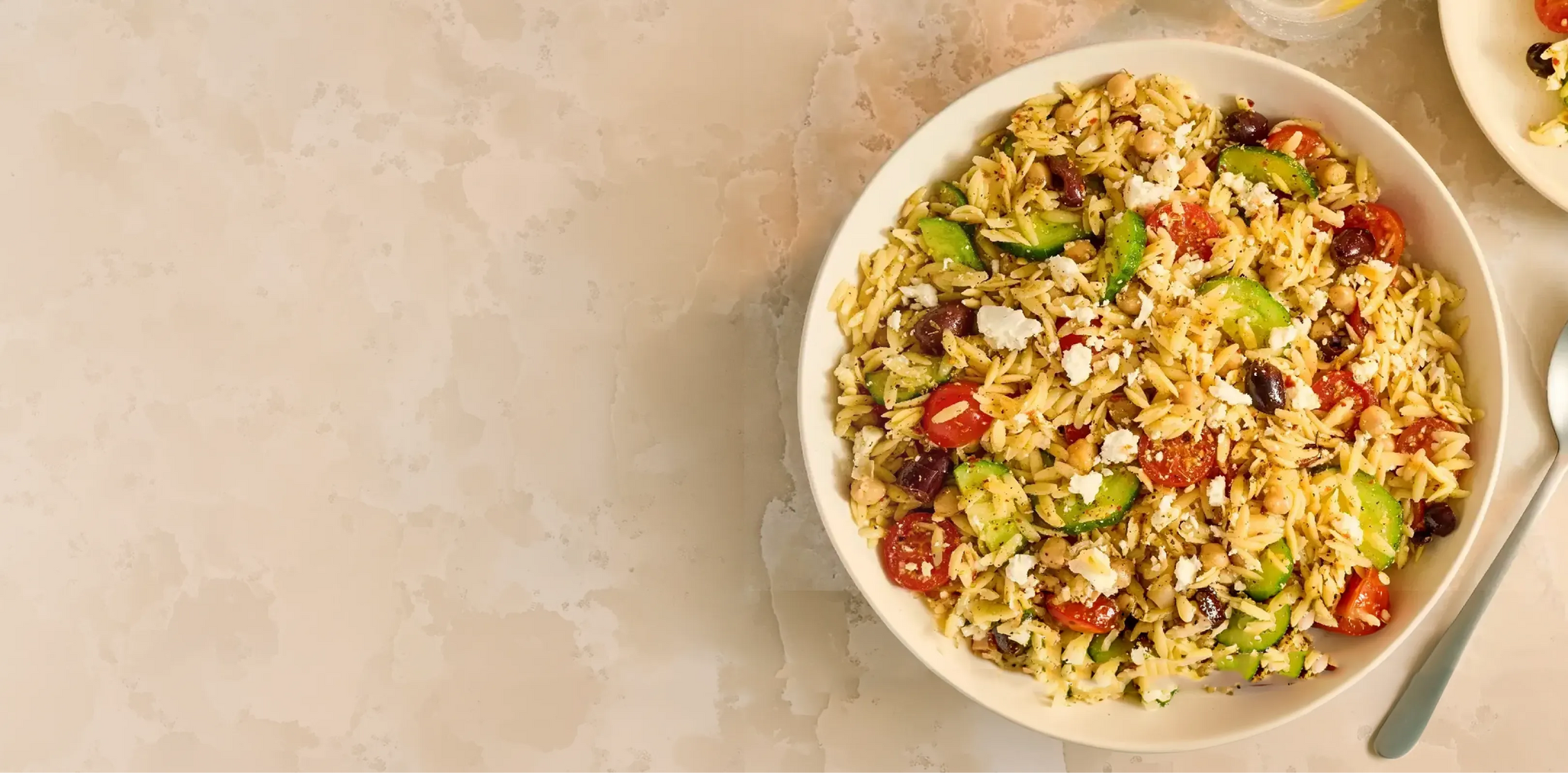  bowl of salad with vegetables on a beige background