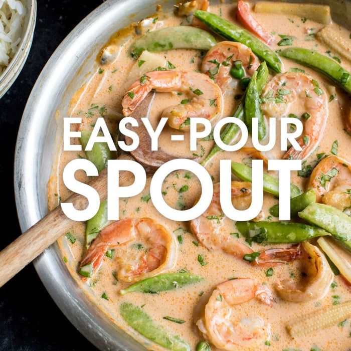 A close-up of a pan of shrimp curry with the text Easy-Pour Spout overlayed on the image.