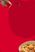 Red bottle pouring sauce over a bowl of pasta on a red background