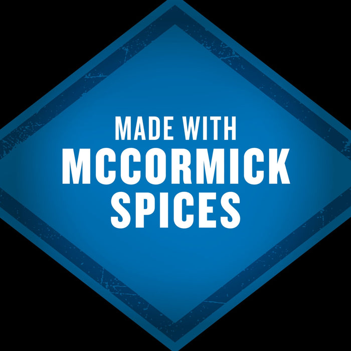 A blue diamond-shaped badge with a distressed texture, for the product Mccormick Grill Mates Gm Bourbon &amp; Oak 3.37 Oz, states MADE WITH MCCORMICK SPICES.