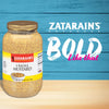 A jar of Zatarain\s Creole Mustard on a blue and beige wood background with the text BOLD like that above it.