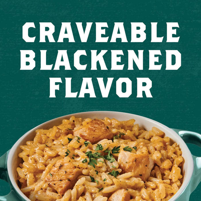 A bowl of rice with chicken and a creamy sauce, with the text Craveable Blackened Flavor above it.