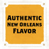 A yellow sign with a black border and fleur-de-lis designs in the corners reads AUTHENTIC NEW ORLEANS FLAVOR.