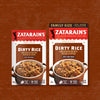 Two boxes of Zatarains Dirty Rice mix, one regular size and one family size, are displayed against a brown background.