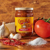 A jar of Cholula Original Medium Salsa with fresh tomatoes, garlic, red pepper flakes, and salt.